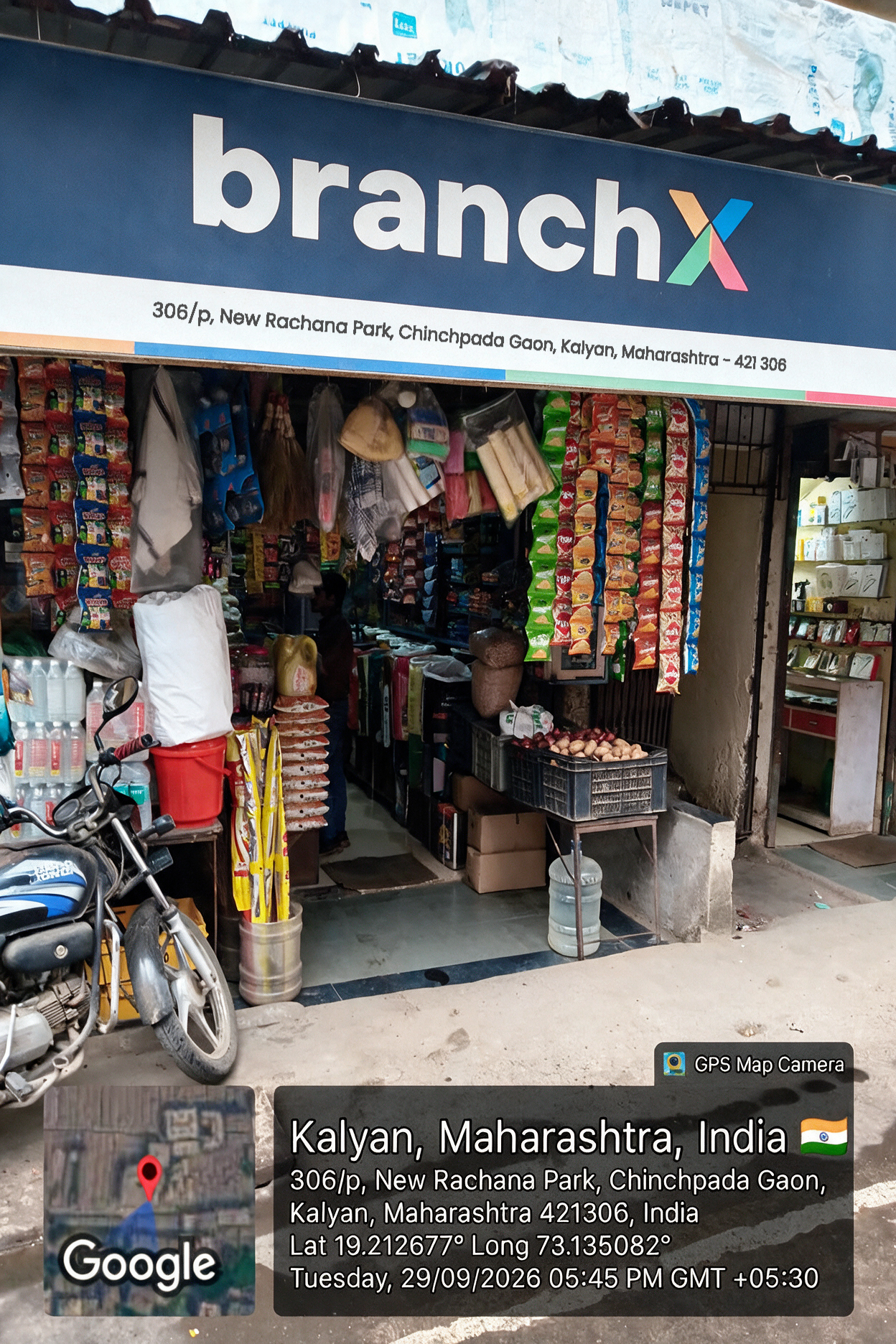 Shopkeeper at the counter of a BranchX-branded kirana store in Mumbai