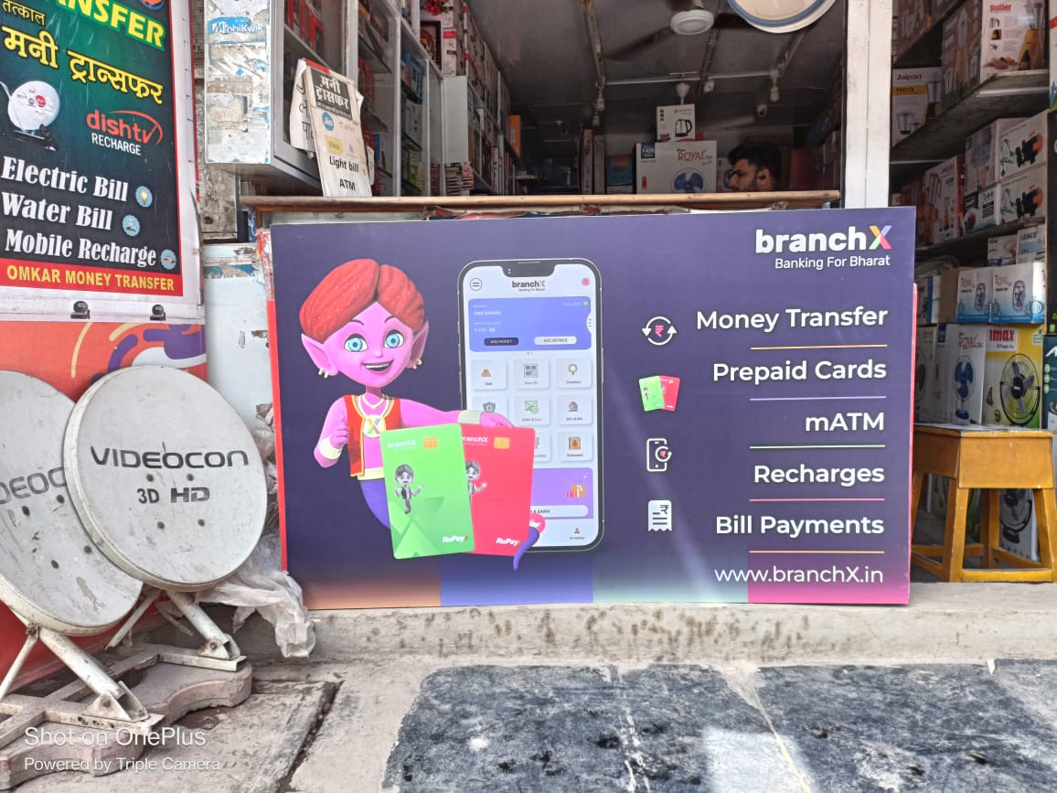 BranchX Banking for Bharat signage outside a neighbourhood recharge and electronics store